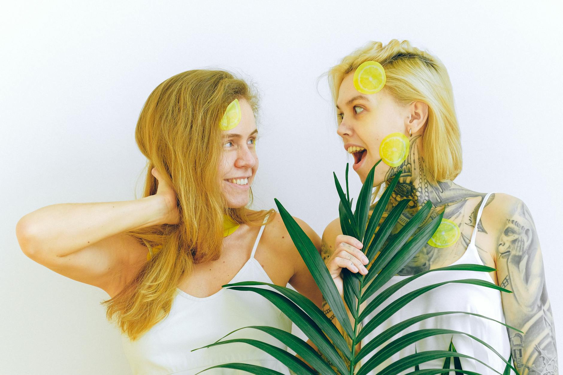 Two women smiling together outdoors, expressing joy and connection