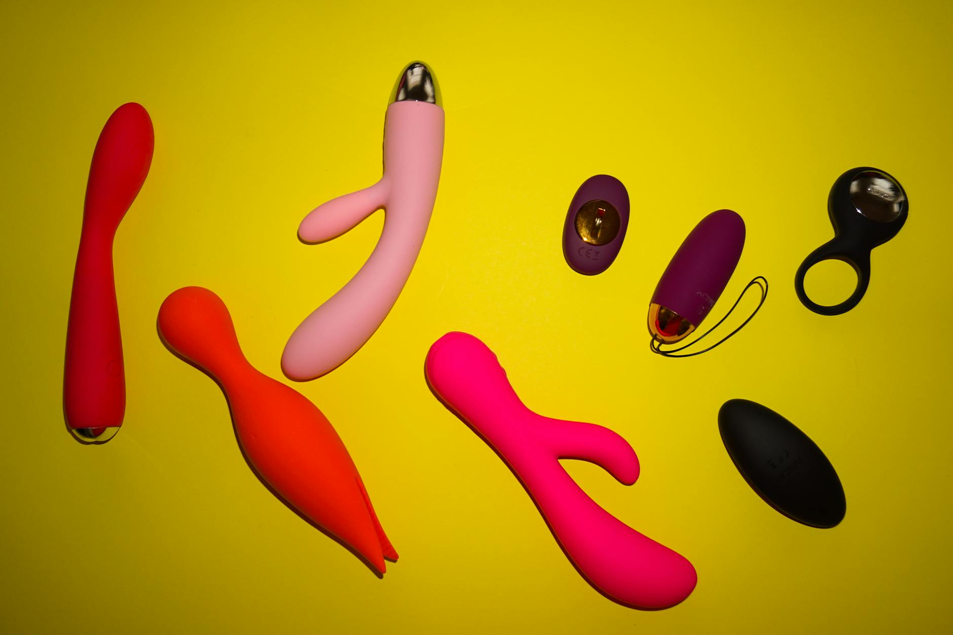 Vibrant collection of lemon clitoral vibrators and sexual wellness toys arranged on a bright yellow background